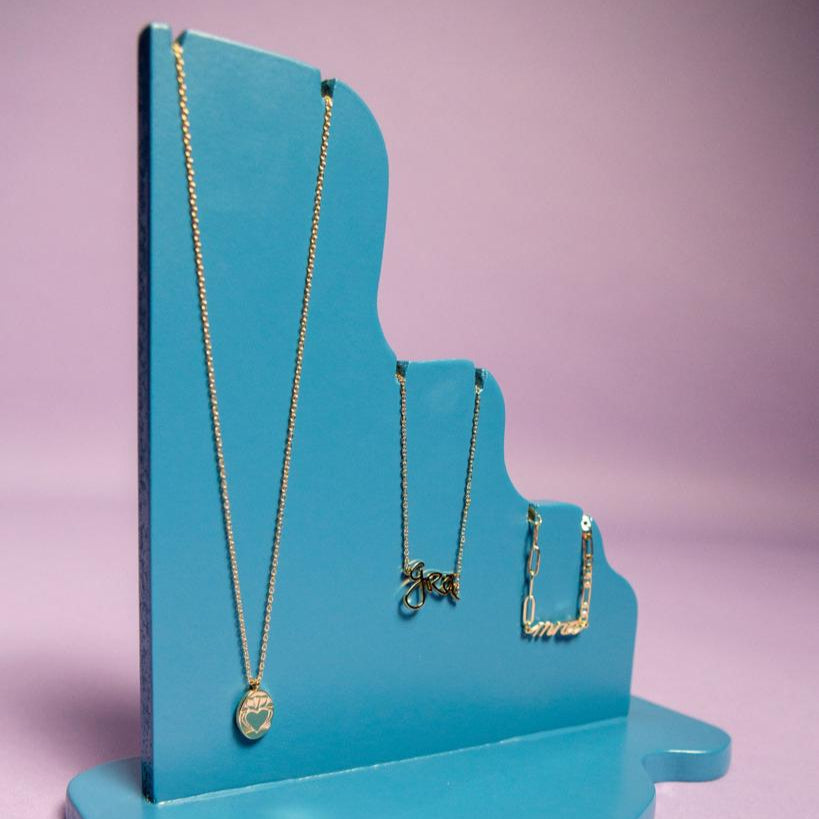 Gold Grá Beag Necklace Displayed