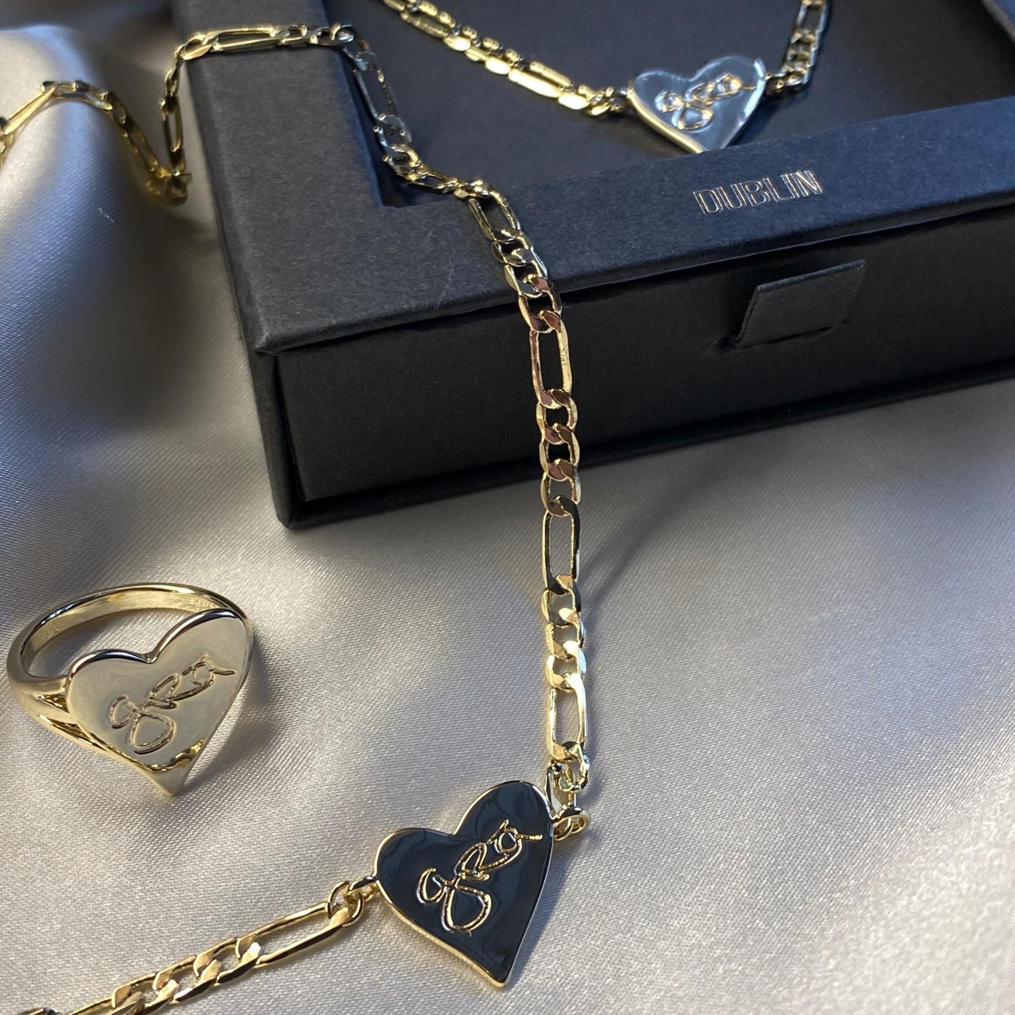 Gold Grá Mór Heart Shaped Necklace with Matching Ring and Gift Box. Handwritten Grá on necklace and ring means love in Irish
