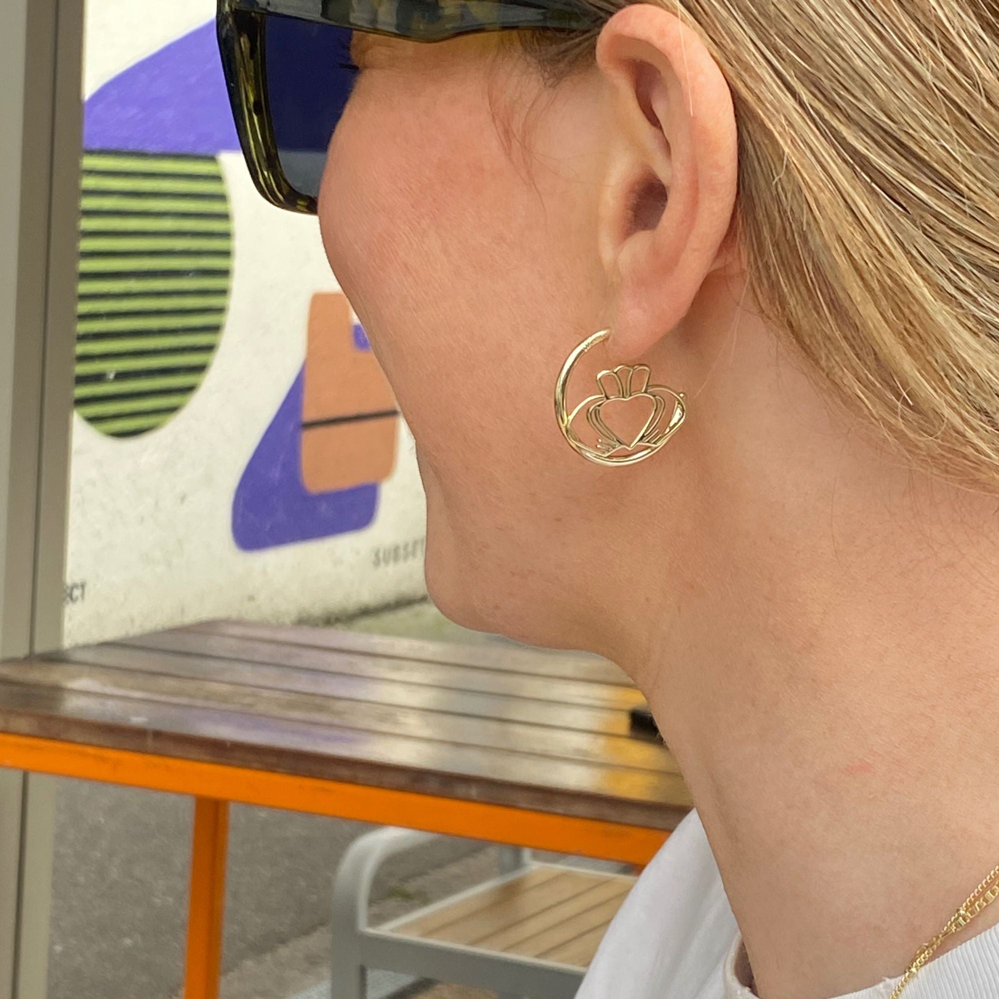 Model wearing Have My Heart Gold Claddagh Hoop Earrings