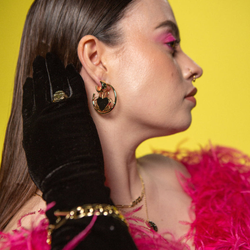 Model Wearing Gold Heart Strong Claddagh Hoop Earrings