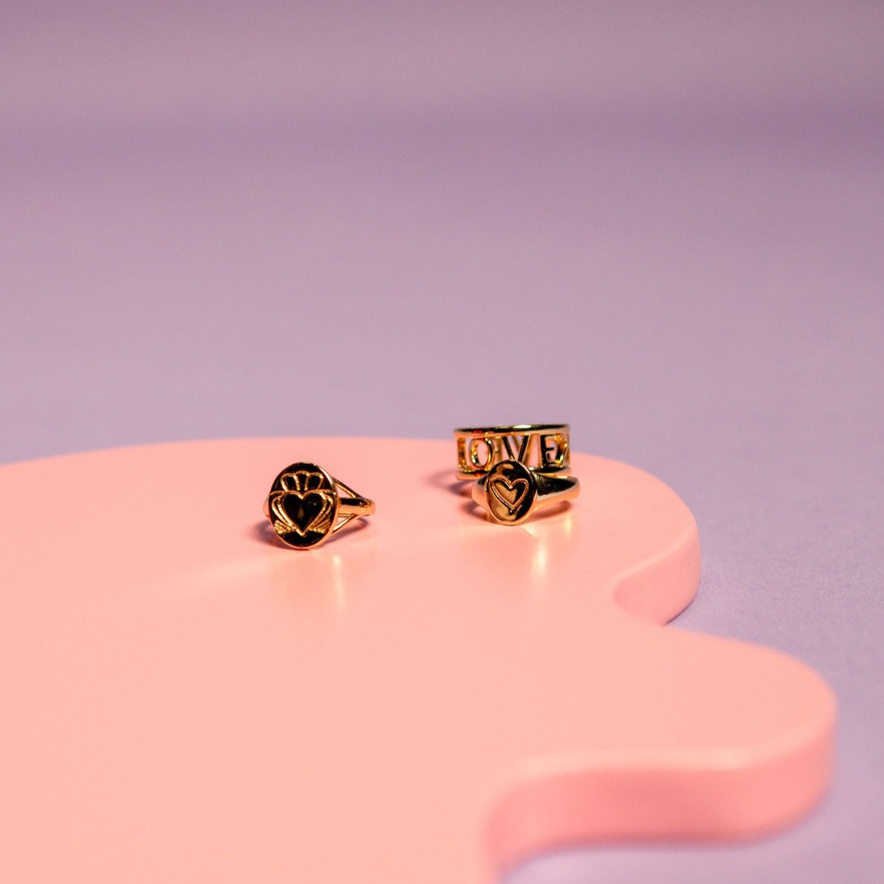 Gold Heart Strong Claddagh Sovereign Ring Displayed with Gold Rings