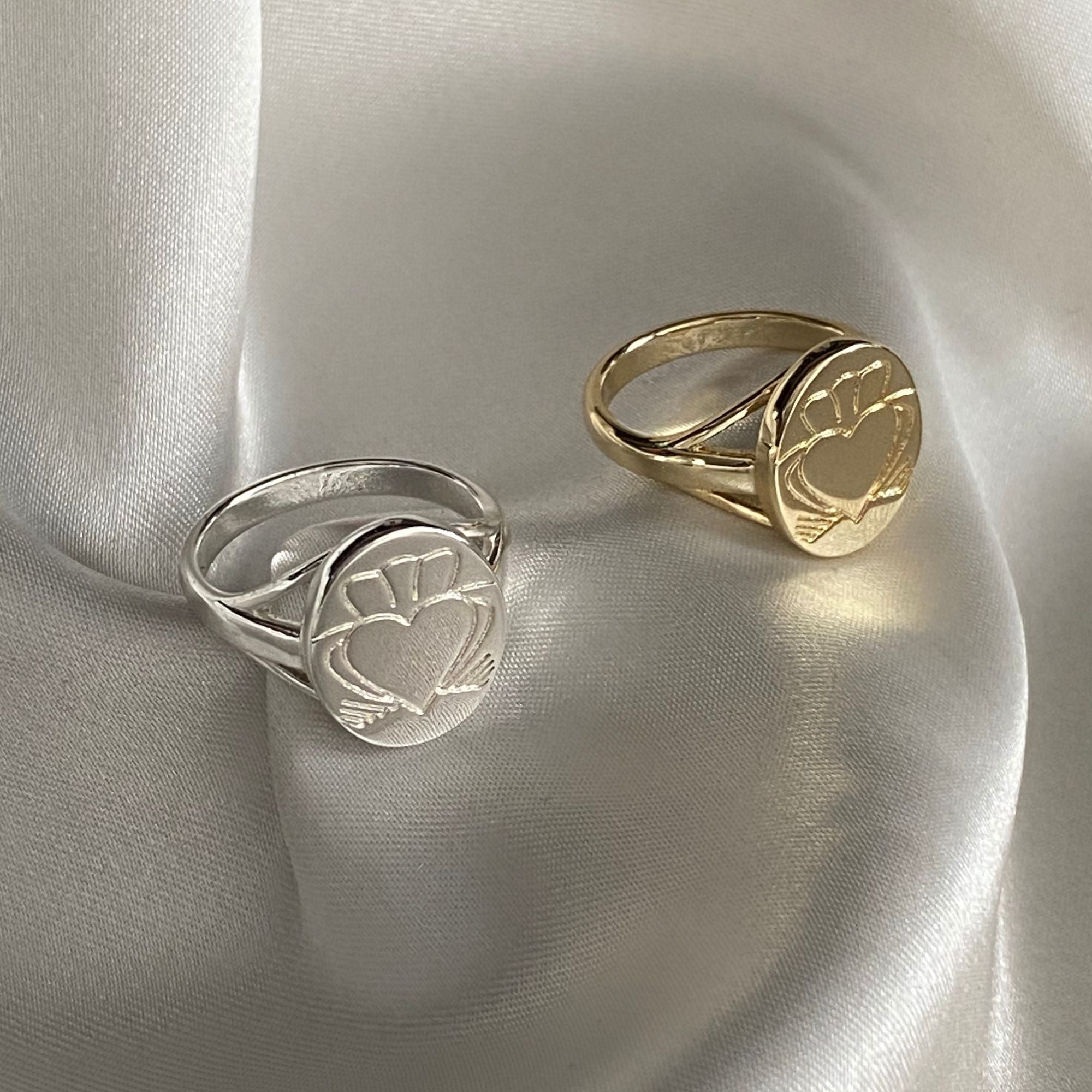 A  Gold and Silver Heart Strong Claddagh Sovereign Ring