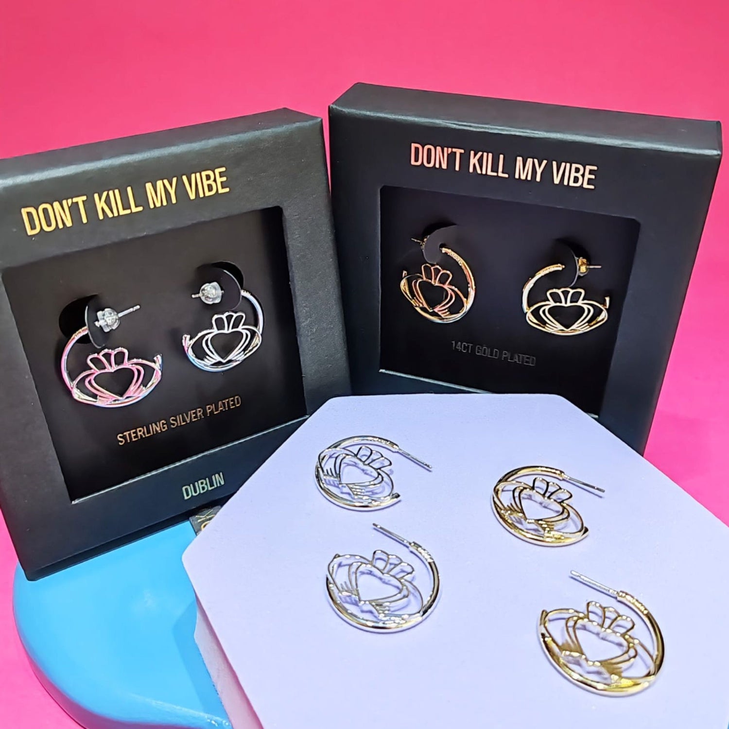 Gold and silver Have My Heart Claddagh Hoop Earrings displayed and in gift boxes 