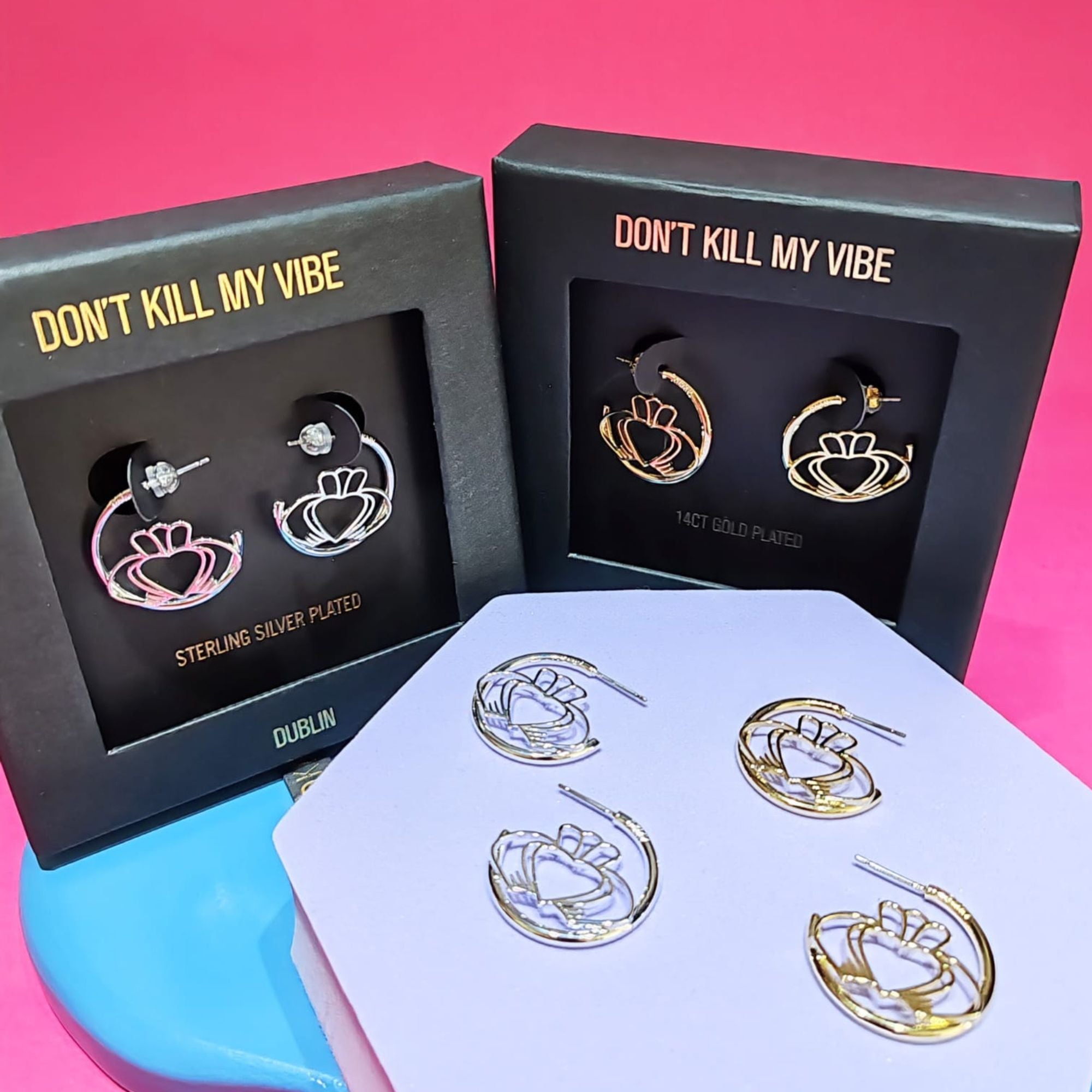 Gold and silver Have My Heart Claddagh Hoop Earrings displayed and in gift boxes 